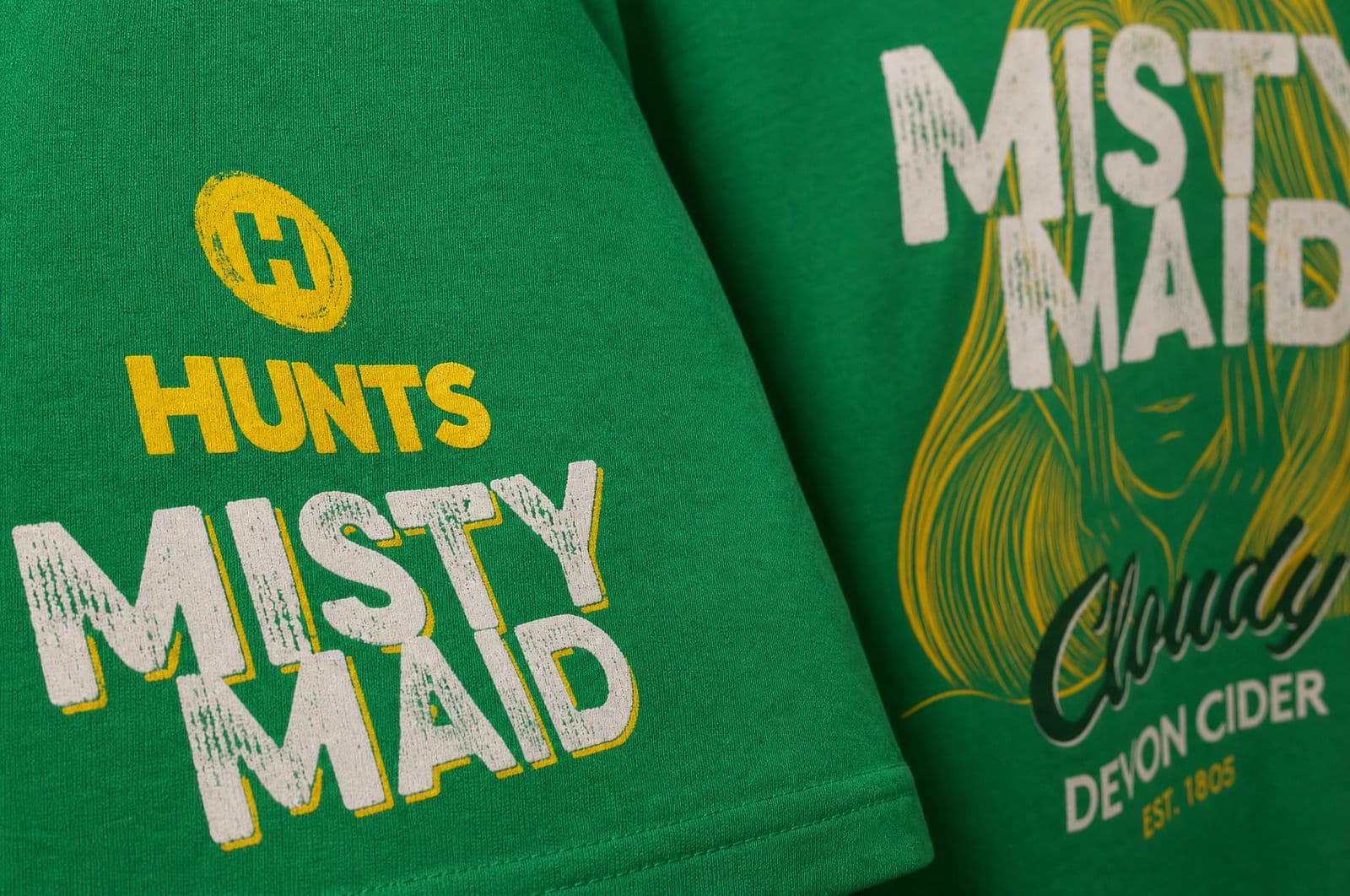 Green t-shirts screen-printed with the Hunts Misty Maid Devon cider design